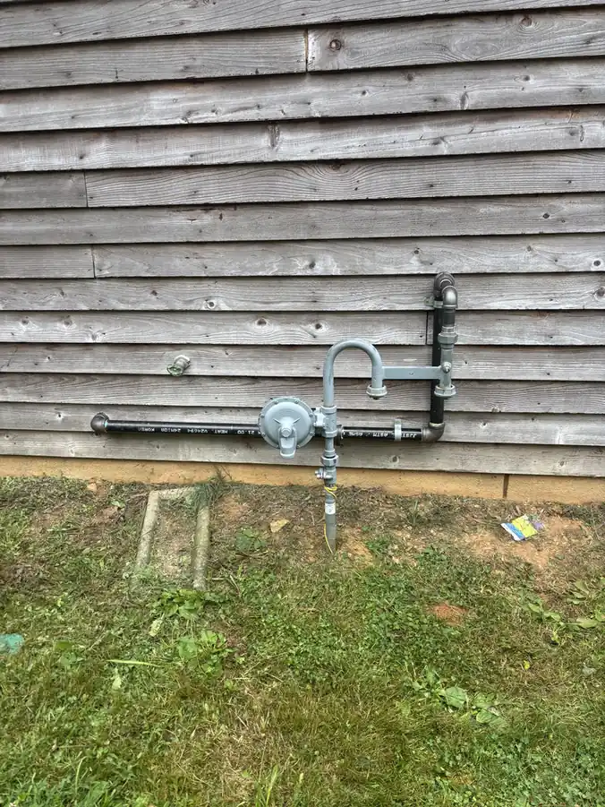 Gas riser and regulator installed on a home