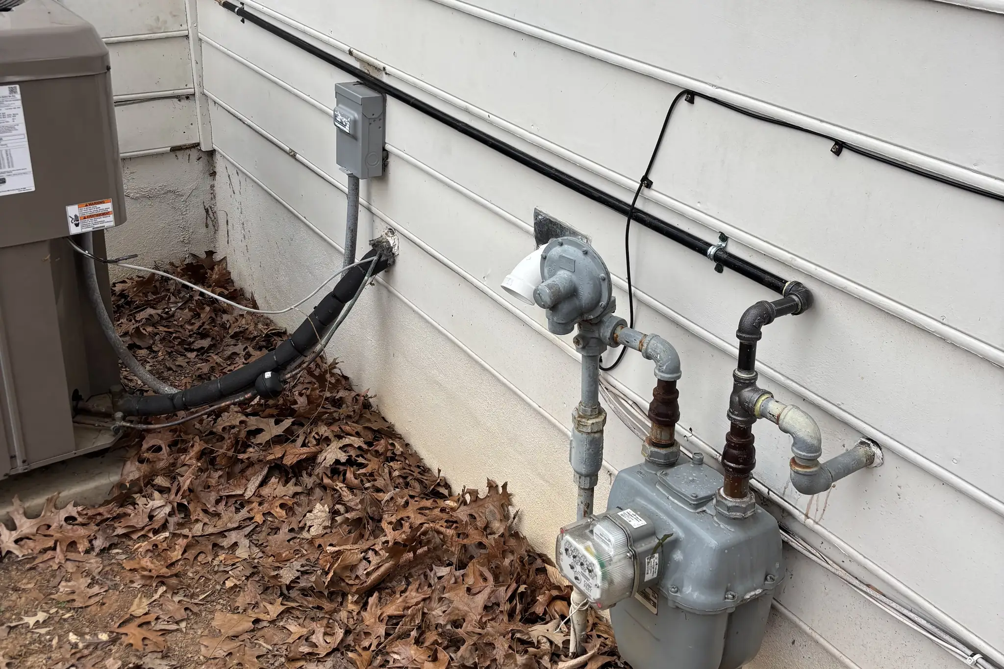 Two gas meters and new gas piping on a home