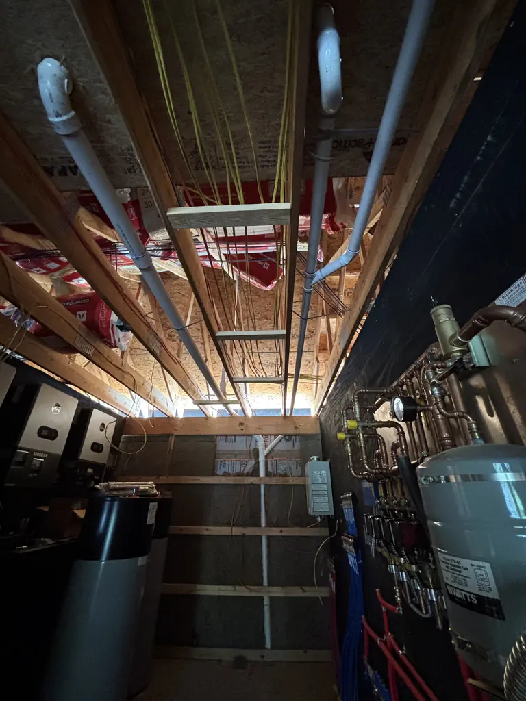 Supply and drain lines in a new home's basement